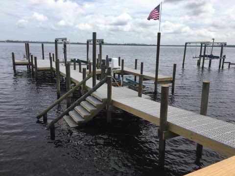 new boat and jetski port dock built and installed by Shoreman's Marine on the water near Destin